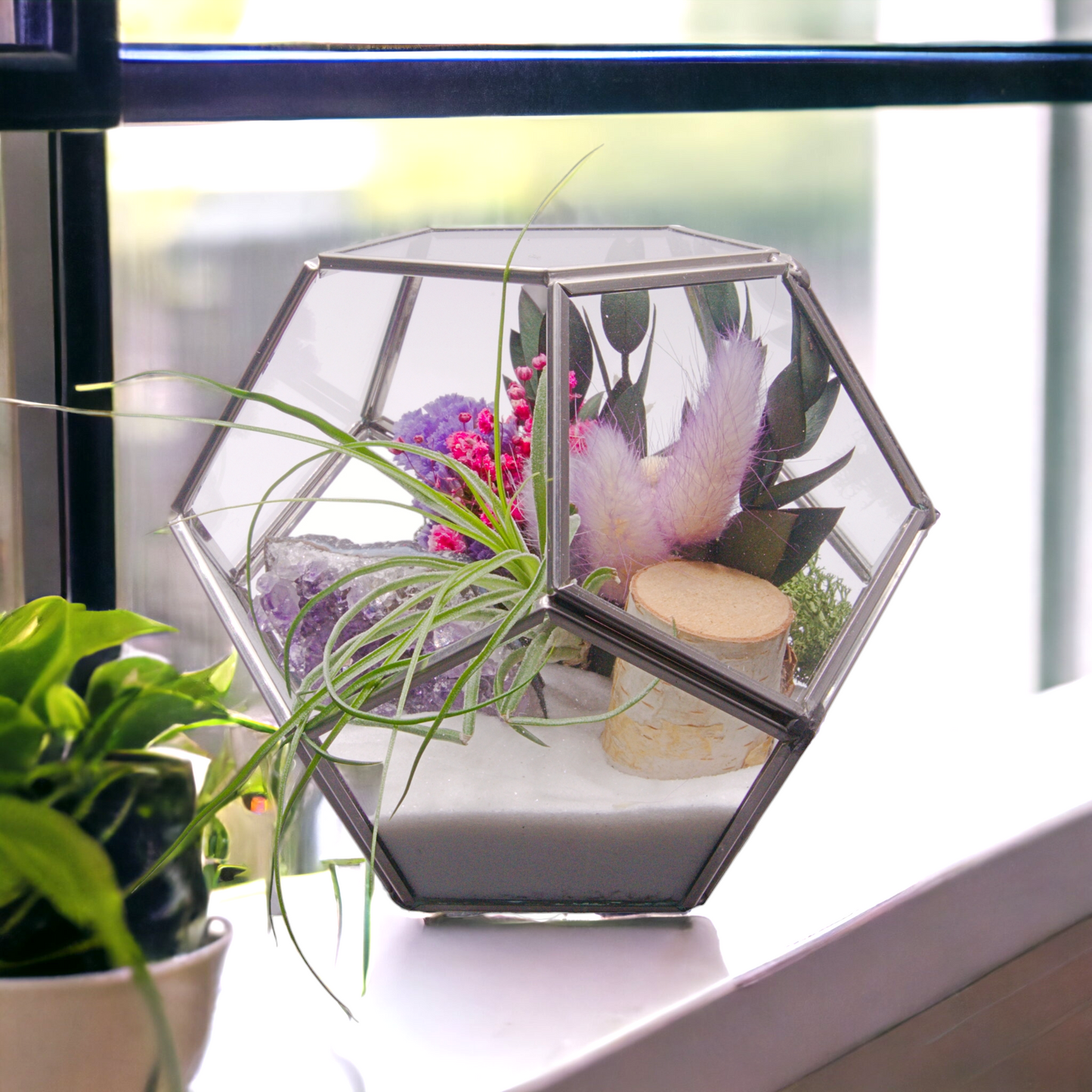 Victorian bowl airplant terrarium with dried flowers, sand, wood, moss and a raw amethyst crystal cluster.