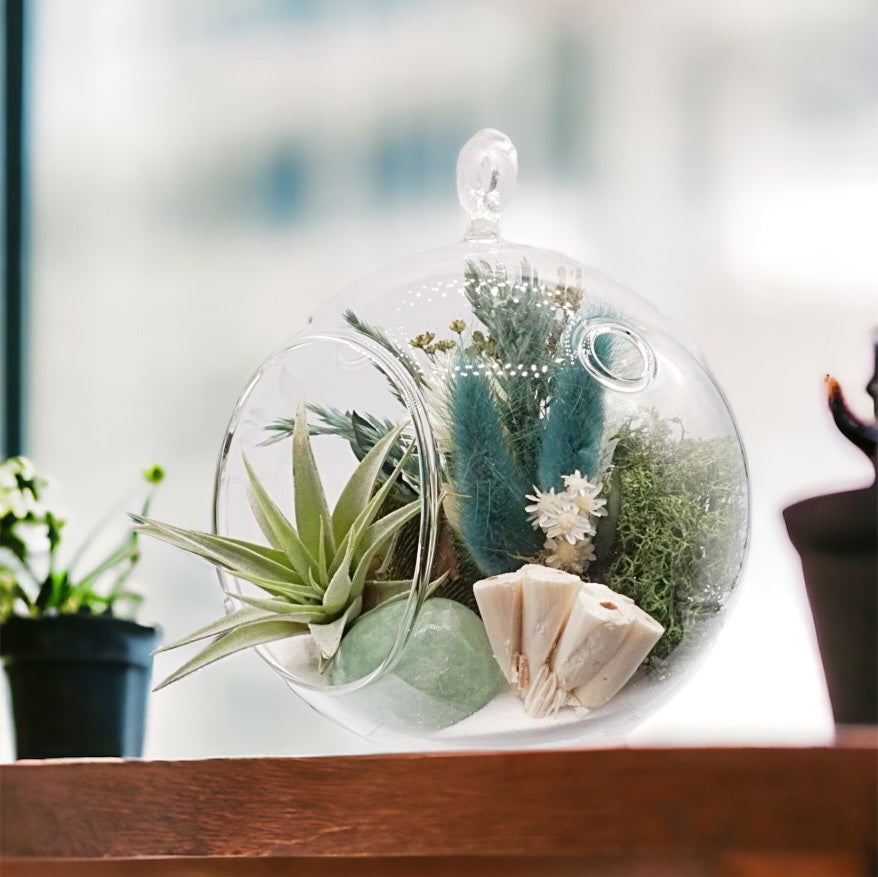 Glass bubble vase airplant terrarium with dried flowers, green fluorite crystal