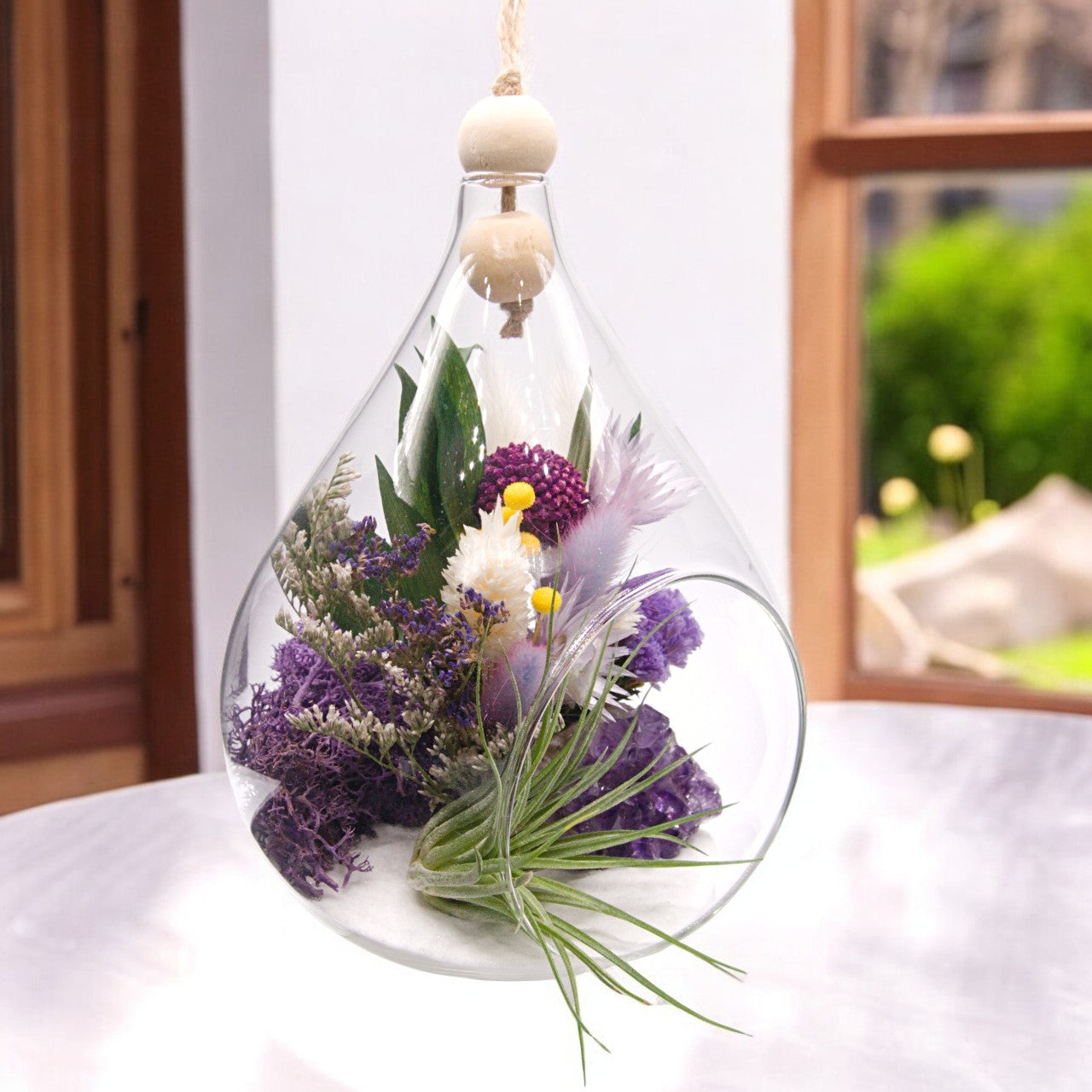 Teardrop airplant terrarium with amethyst crystal, dried flowers, wood and moss
