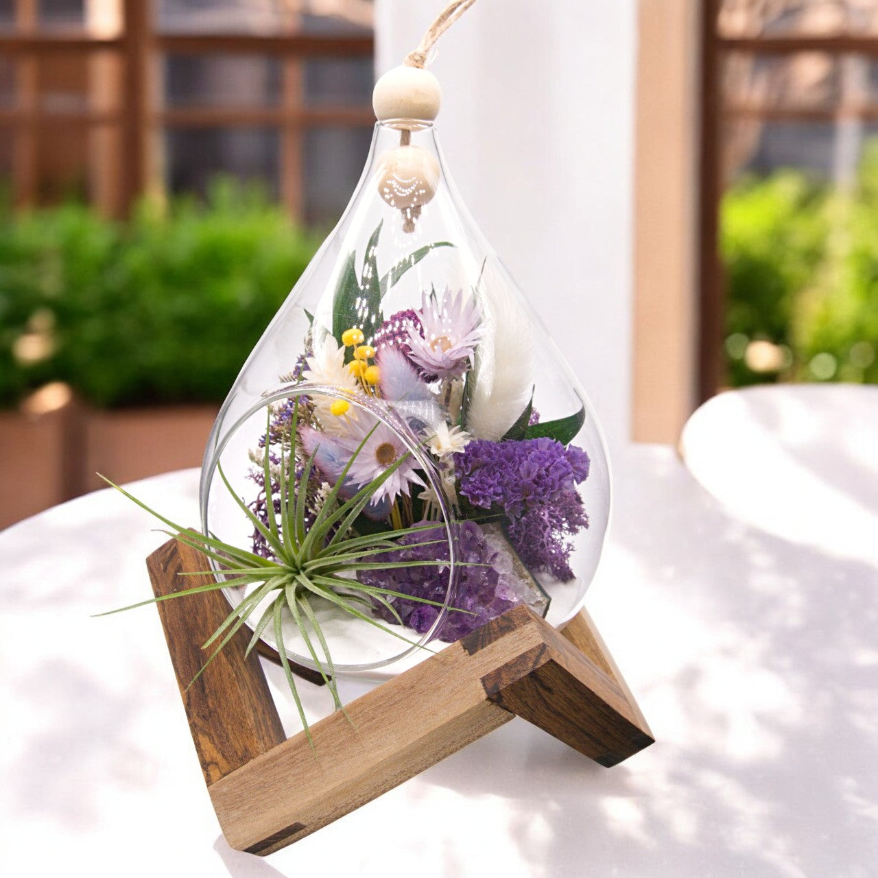 Teardrop airplant terrarium with amethyst crystal, dried flowers, wood and moss