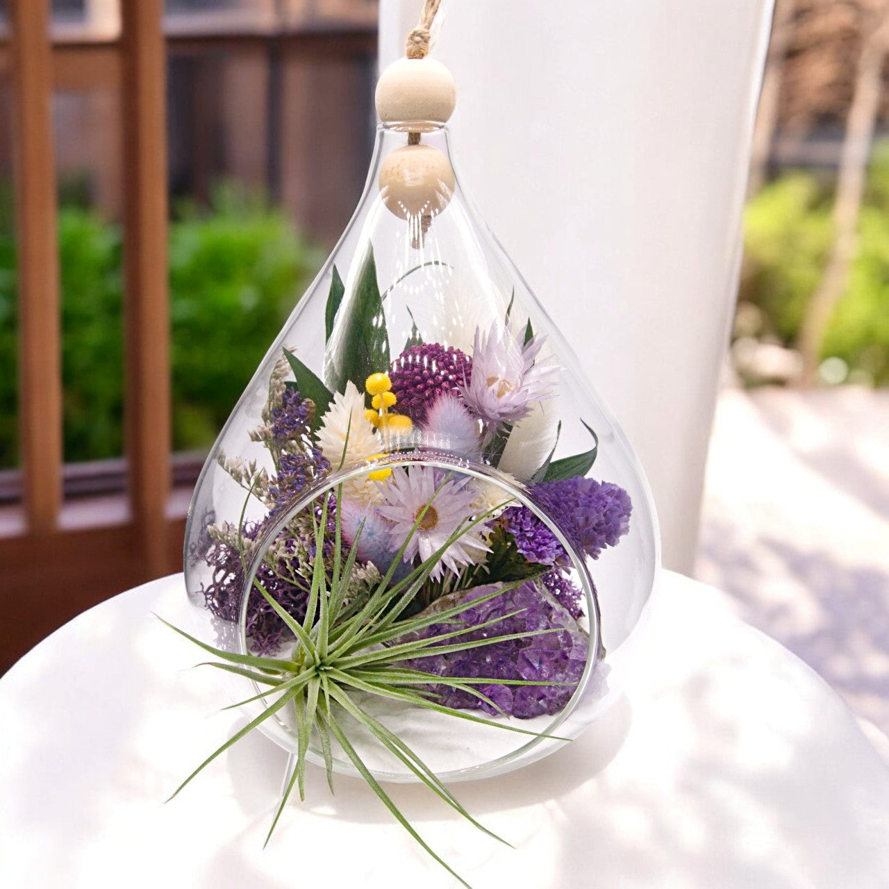 Teardrop airplant terrarium with amethyst crystal, dried flowers, wood and moss