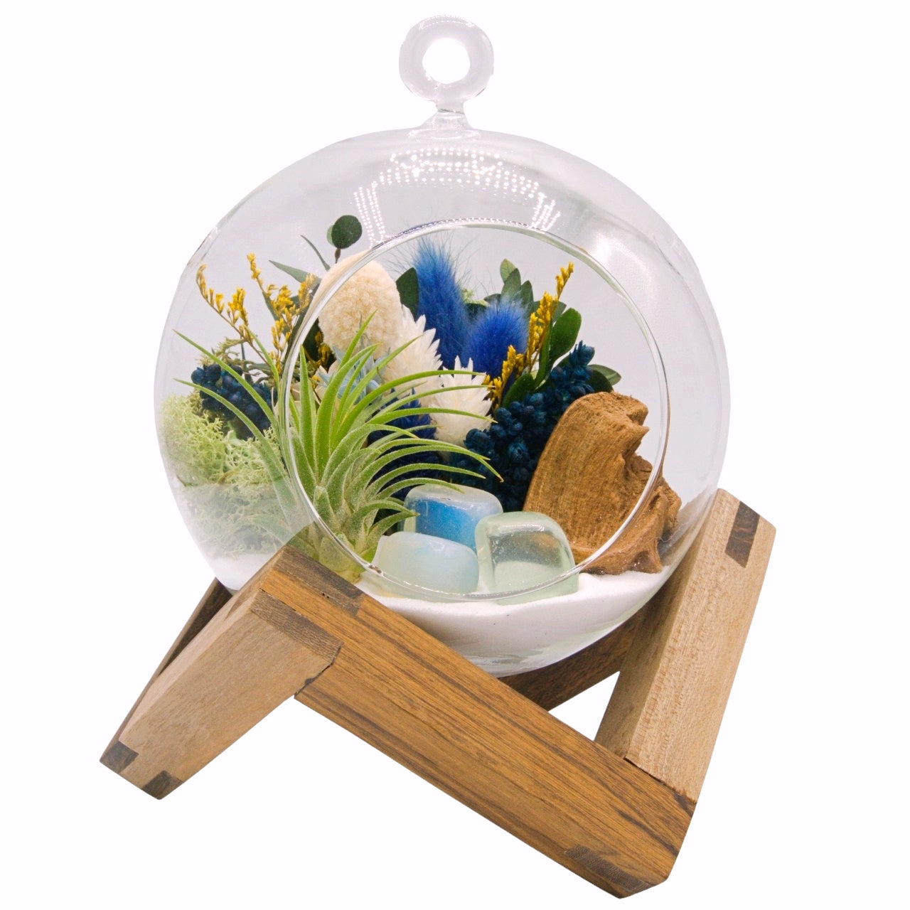 airplant terrarium with dried flowers and three opalite crystals