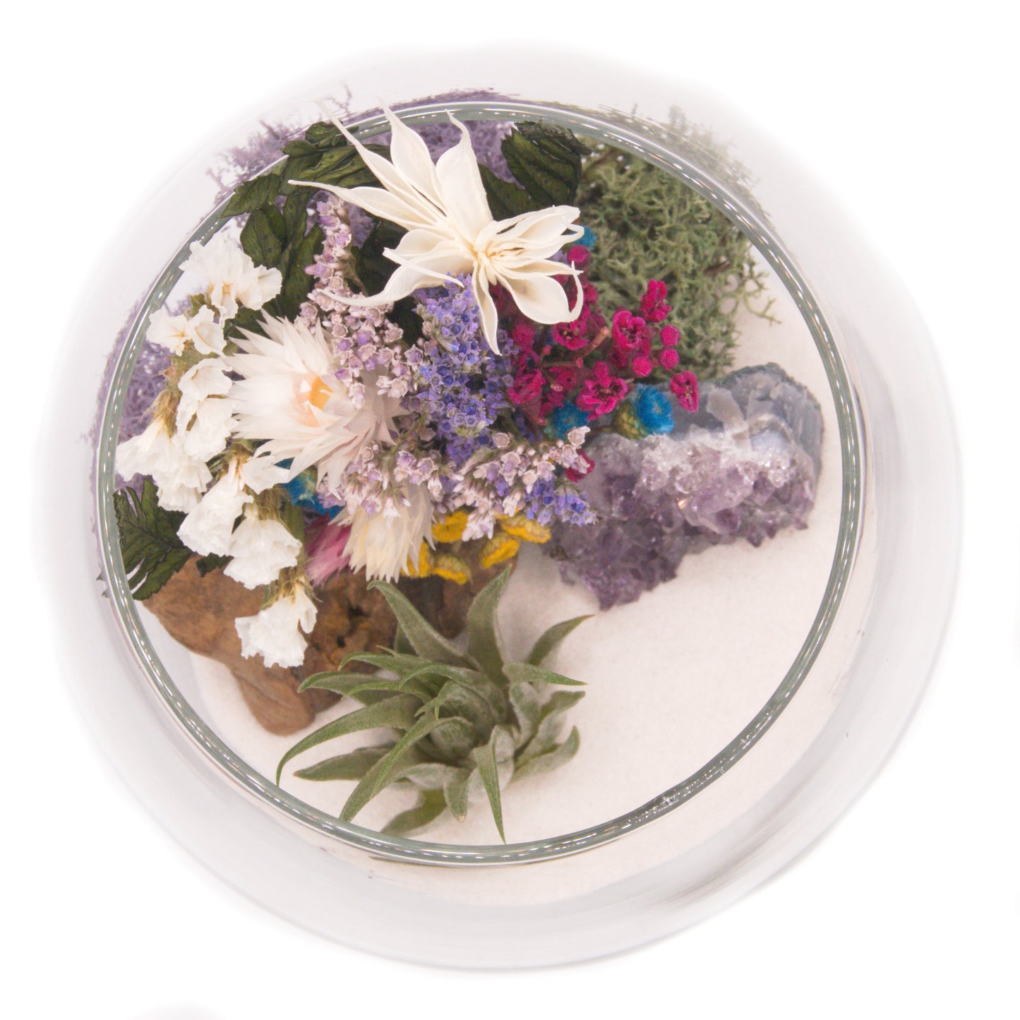 Airplant terrarium in a glass bowl with a bouquet of dried flowers, moss, wood and a raw amethyst crystal.