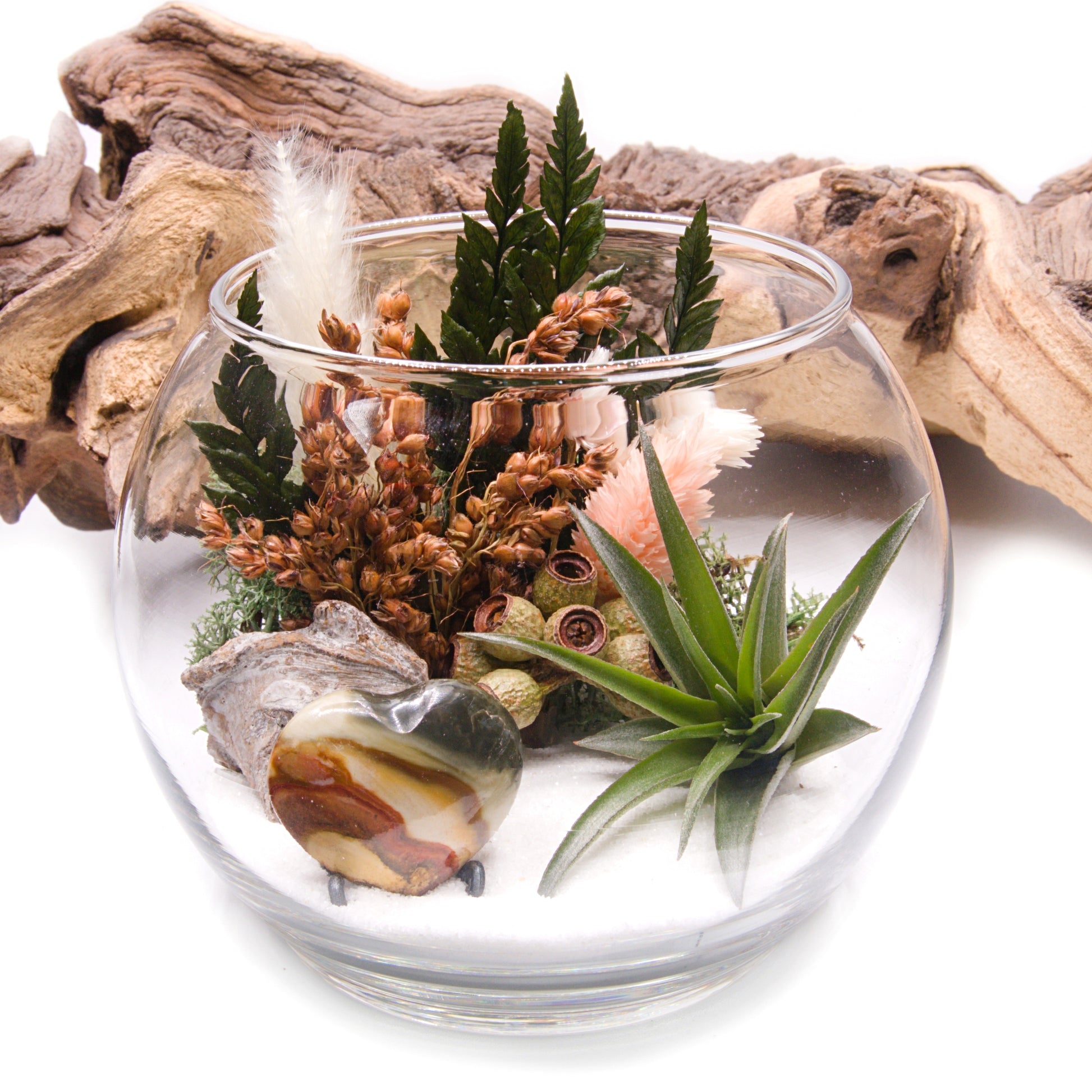 Glass bowl airplant terrarium with a bouquet of dried flowers, moss, wood and a jasper heart stone