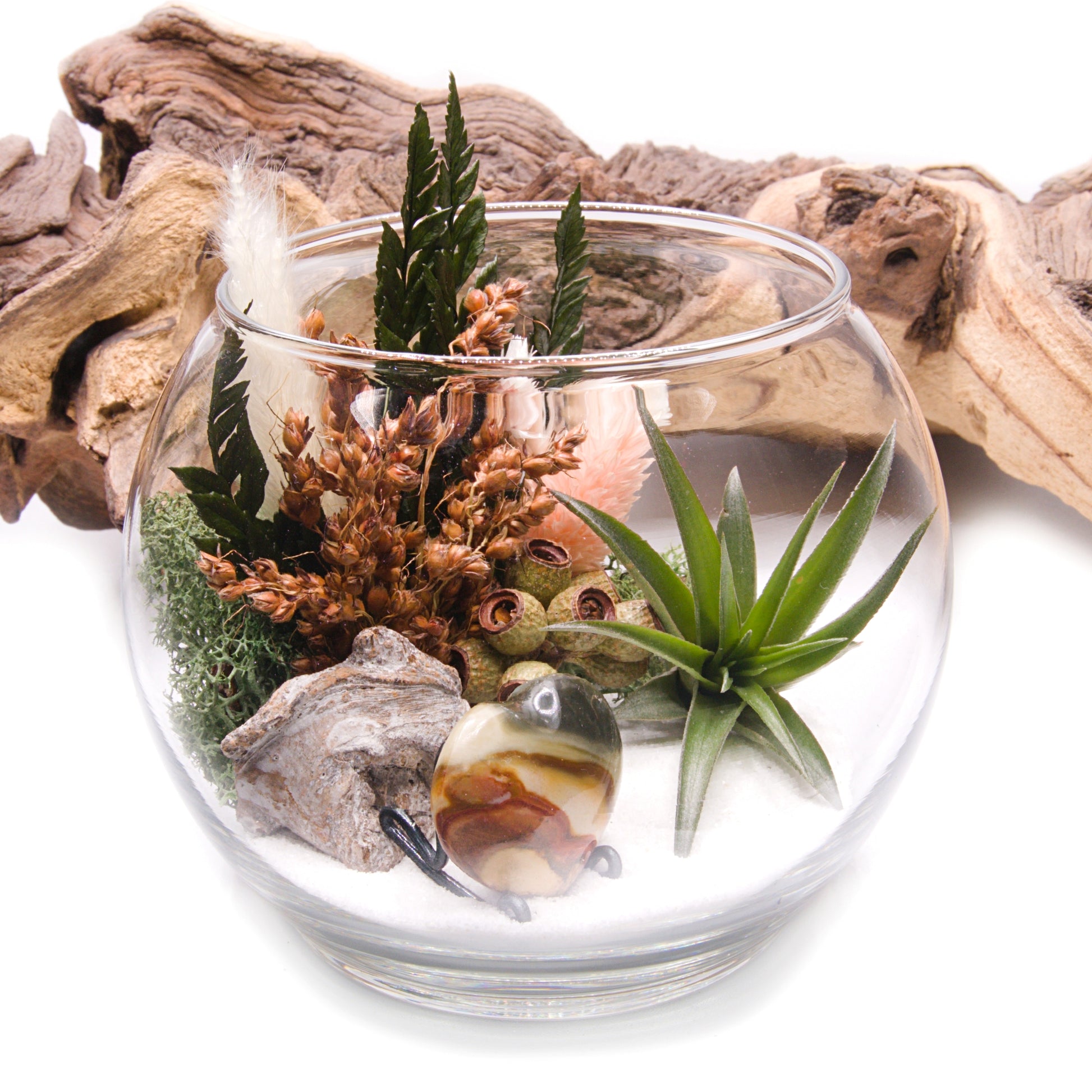 Glass bowl airplant terrarium with a bouquet of dried flowers, moss, wood and a jasper heart stone