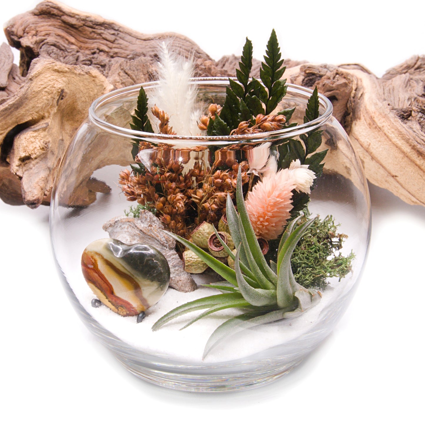 Glass bowl airplant terrarium with a bouquet of dried flowers, moss, wood and a jasper heart stone