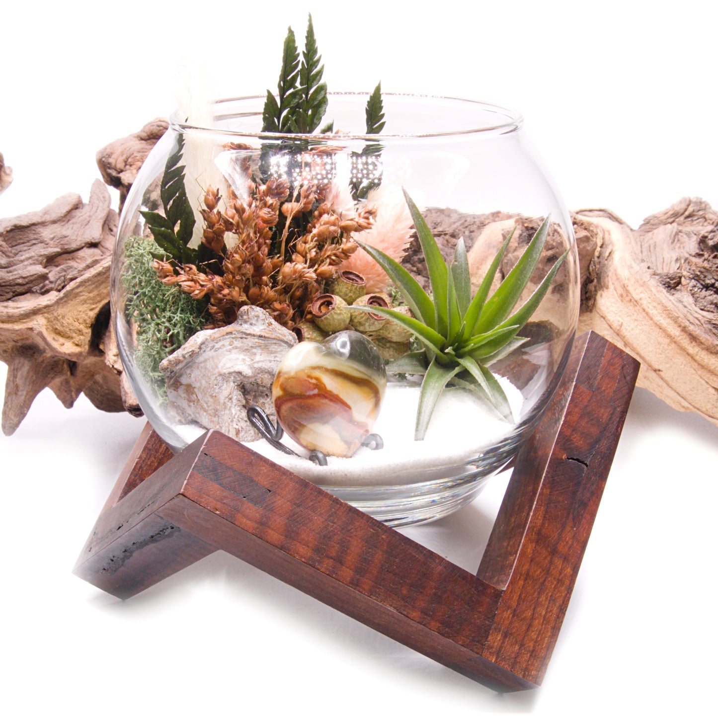 Glass bowl airplant terrarium with a bouquet of dried flowers, moss, wood and a jasper heart stone