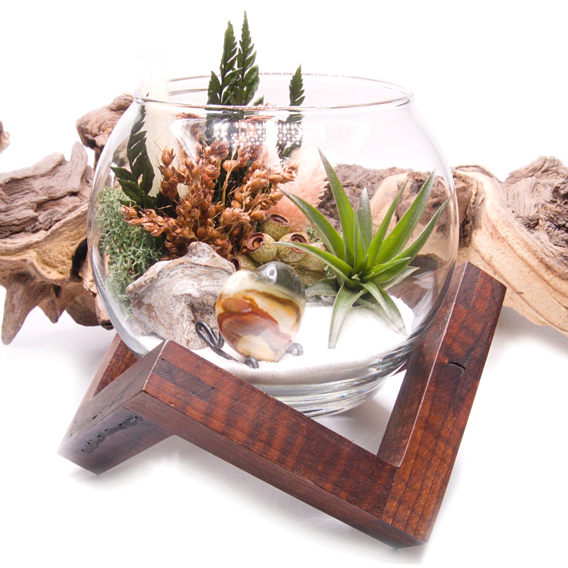 Glass bowl airplant terrarium with a bouquet of dried flowers, moss, wood and a jasper heart stone